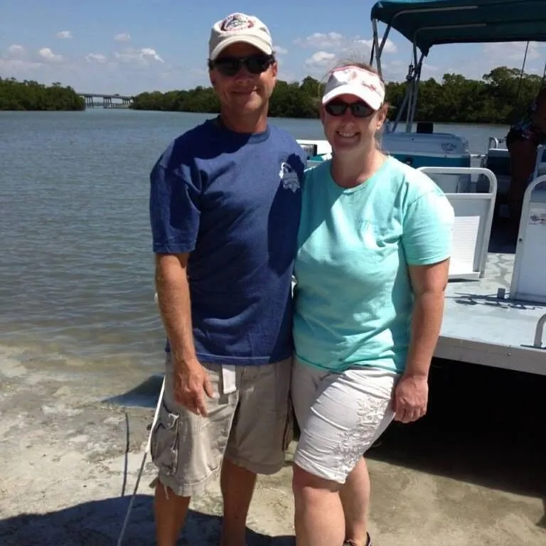 Captain Jeff and Captain Christy Littlejohn aboard their charter boat
