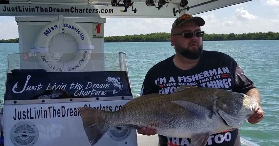 Angler with a catch on Estero Bay